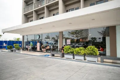 a building with benches and plants in front of it at Shore Residences Tower C, Pasay near SM MOA, please text or call us ASAP once booked for the guest authorization form in Manila