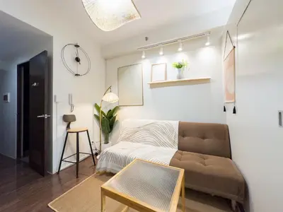 a living room with a couch and a table at GemstoneBR II@SMDC Air Residences in Manila