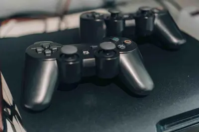 a group of video game controllers sitting on a table at Azure 1BR citylights with netlfix near airport in Manila