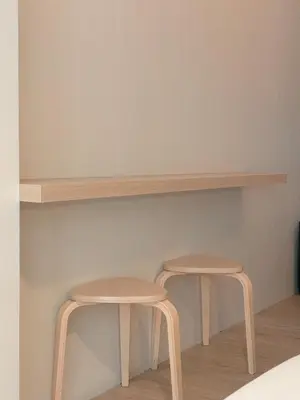 two stools sitting under a shelf in a room at Manila Staycation Rental in Manila