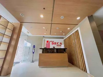 a lobby with a sign in a building at Urban Deca EDSA Staycation w/Unli Wi-Fi & Netflix in Manila