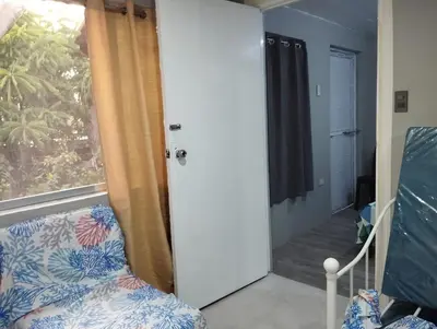 a room with a chair and a window at 25 Guest - Unit 1,2&3 - 2 units Bungalow and Studio type in Santa Rosa