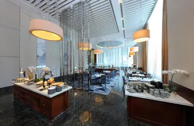 a lobby with a buffet line in a building at Makati Diamond Residences in Manila