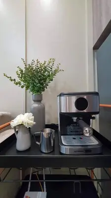 a table with a coffee maker and a blender at Luxury Condo with a view of Manila Bay in Manila