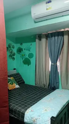 a bedroom with a bunk bed and a wall with fish on it at Dencios Transient in Cabuyao