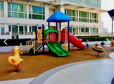a playground in front of a building with a slide at Modern 2BR in Central Makati! Netflix Wi-Fi Pool in Manila