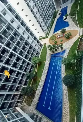 an overhead view of a large building with two swimming pools at 2 Condos, 5 Beds, 2 CR @ Shore2 MOA (3rd&5th Flrs) in Manila