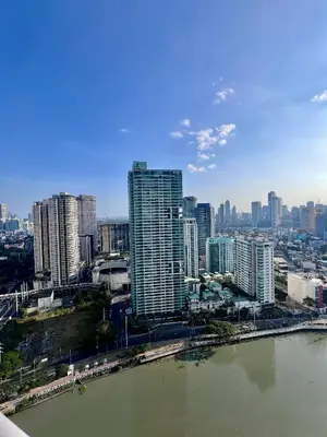 a view of a city with a river and buildings at Acqua Private Residences - Livingstone Tower (Makati - Mandaluyong) in Manila