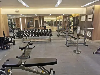 a gym with rows of chairs and machines at Mall of Asia shore 3 tower 2 condotel in Manila