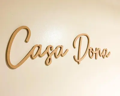a sign for a spa clinic written in gold at Casa Dona Suites at SMDC Charm Residences in Manila