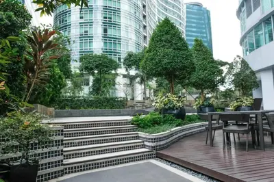 a garden with stairs and a table and chairs at Solana in Avant BGC parking with fee in Manila
