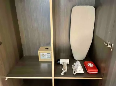 a cupboard with a sink and a box on a shelf at Tarzan in the City! in Avant BGC parking with fee in Manila