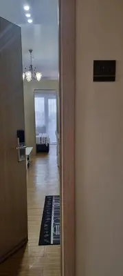 a hallway with a door leading to a living room at Suite 2253 in Manila