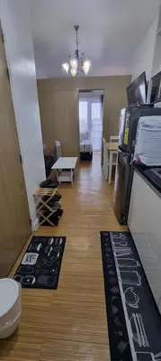 a room with a kitchen and a living room at Suite 2253 in Manila