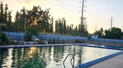 a swimming pool in a yard with trees at HeRo's Lair - Staycation near EK with Ps4 & more! in Santa Rosa