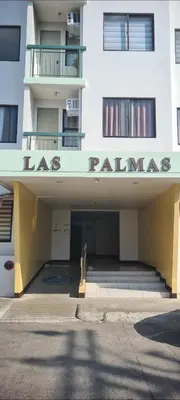 a large white building with a sign that reads las palms at HeRo's Lair - Staycation near EK with Ps4 & more! in Santa Rosa