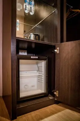 a kitchen with an empty oven in a room at Green Sun Hotel in Manila