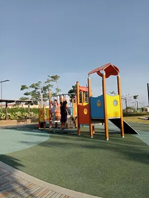 a group of children playing on a playground at Suite by Xavie The Verdin by MAPLE Grove in General Trias