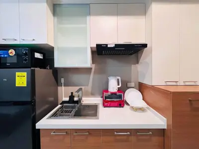 a small kitchen with a sink and a refrigerator at 1BR Condotel Suite at Sunshine100 City Plaza #SS06 in Manila