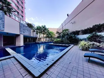 a swimming pool in the middle of a building at 1BR Condotel Suite at Sunshine100 City Plaza #SS03 in Manila