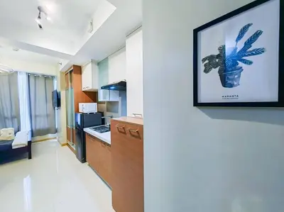 a kitchen with a picture of a plant on a wall at 1BR Condotel Suite at Sunshine100 City Plaza #SS03 in Manila