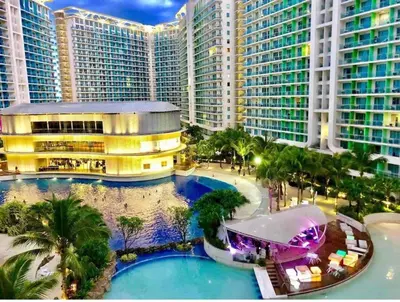 an aerial view of a resort with palm trees and buildings at 1BR Condotel at Azure Urban Resort Near Airport #AZ02 in Manila