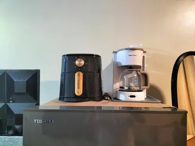 a coffee maker sitting on top of a counter at STANFORD SUITES 3 in Silang