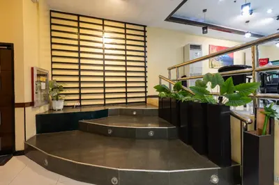 a large room with plants in the middle at Hotel Sogo Cainta in Manila