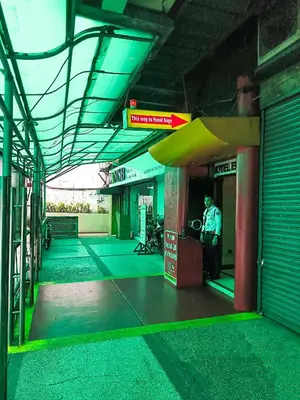 a gas station with a man standing at the pump at Hotel Sogo Kalentong in Manila