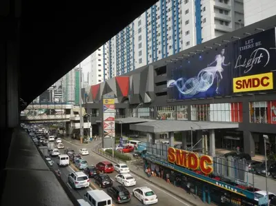 a busy city street filled with lots of traffic at 1BR Condotel with Balcony at SM Light Residences #LT05 in Manila