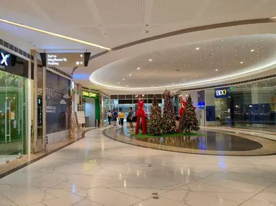 a shopping mall with christmas trees in the middle at 1BR Condotel with Balcony at FAME Residences #FM13 in Manila