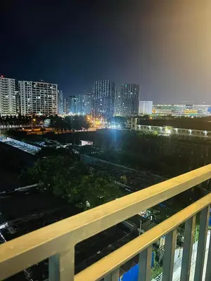 a view of a city at night with buildings at The Q's Place in Manila