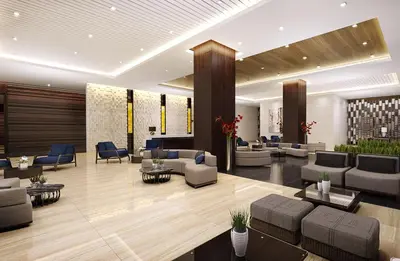 a lobby with couches and chairs in a building at SMDC Coast Residences in Manila