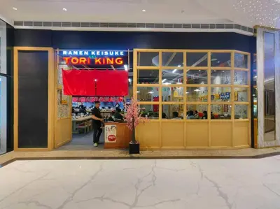 a person standing in front of a fast food restaurant at 1BR Condotel with Balcony at FAME Residences #FM38 in Manila
