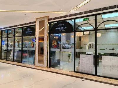 a store front with glass doors in a shopping mall at 1BR Condotel with Balcony at FAME Residences #FM39 in Manila