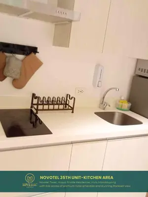 a kitchen with a sink and a counter top at Novotel Tower at Mandaluyong Rockwell View in Manila