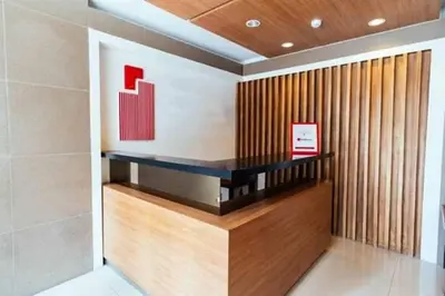 a lobby of a building with a wall at Urban Deca Tower OYO 2 in Manila