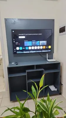 a flat screen tv sitting on top of a black entertainment center at URBAN DECA R1125 Ortigas SM EAST in Manila