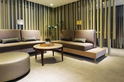 a living room with two couches and a coffee table at Executive Stay with Balcony & Malls at Uptown BGC in Manila