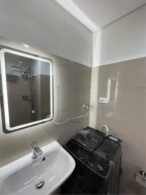 a bathroom with a sink and a mirror at Perfect blend of home & comfort in Manila