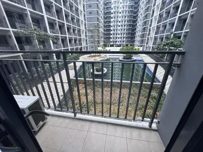 a balcony with a view of some tall buildings at Shore 2 Residences in Manila