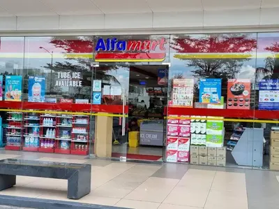 a store front of a store with a bench in front at Cozy Shore Residence with balcony near Mall of Asia & airport in Manila
