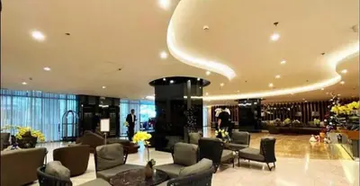 a lobby with couches and chairs in a building at Shore 2 Residences high speed Internet walking distance to MOA and IKEA in Manila