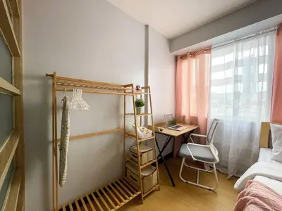 a bedroom with a bed and a desk and a deskablish at Cozy & Affordable Stay Near Bgc #rt33005 in Manila