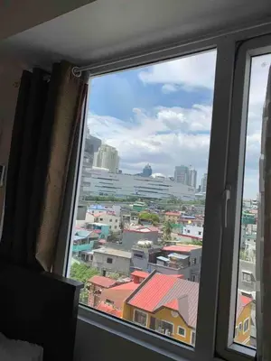 a view of a city from a window at Budget-friendly Condo Near Bgc, Venice #rt34008 in Manila