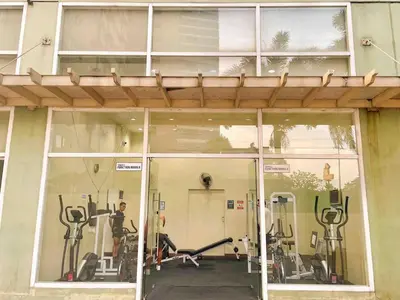 a gym with exercise equipment inside of a building at Budget-friendly Condo Near Bgc, Venice #rt34008 in Manila
