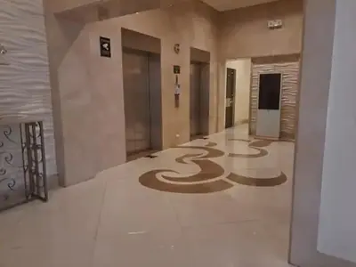 an empty lobby with a large snake painted on the floor at 1Bedroom Accommodation Near Airport in Manila