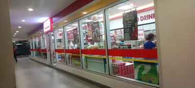 a store aisle of a grocery store with glass windows at BLUE sea Residences in Manila