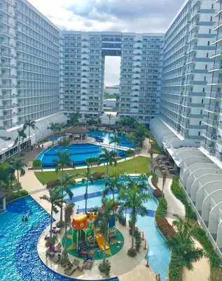 an aerial view of a water park at a resort at 633 Air Condo Pool View Escape Cozy 1BR w Sofa Bed in Manila