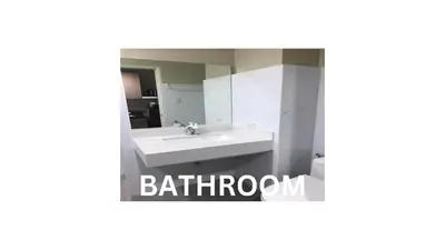 a bathroom with a sink and a mirror at Cozy 1 Bedroom Apartment for Long Term Rentals in Manila